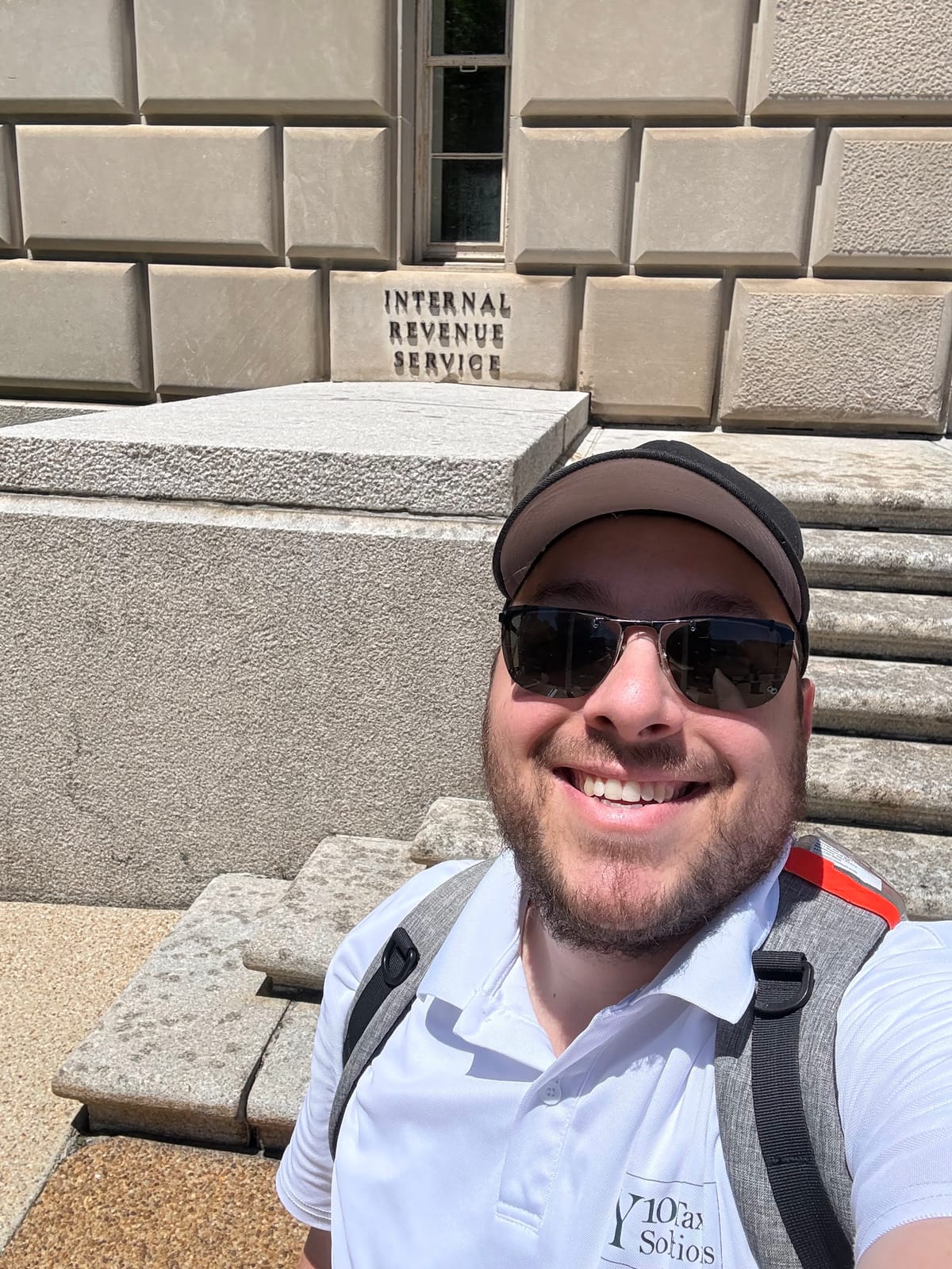 Yehuda in front of the IRS building